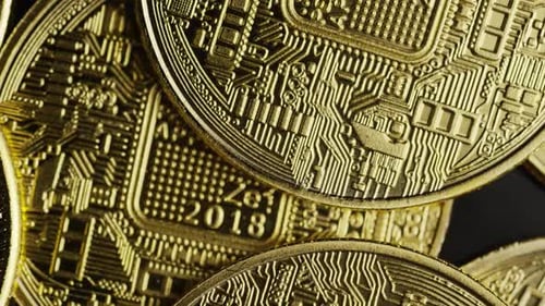 Rotating shot of Bitcoins (digital cryptocurrency) - BITCOIN