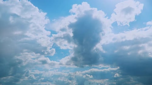 Clouds Drifting Across Blue Sky