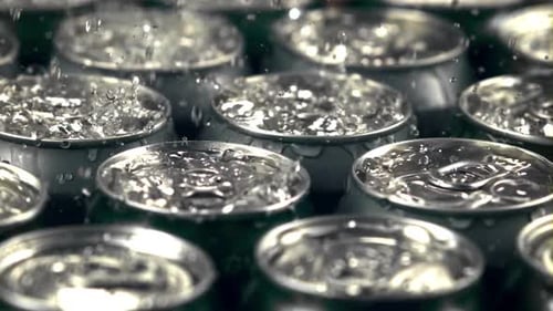Super Slow Motion on Tins with Beer Drop Drops of Water with Spray