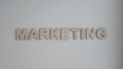 Spelling Out the Word Marketing With Wooden Letters
