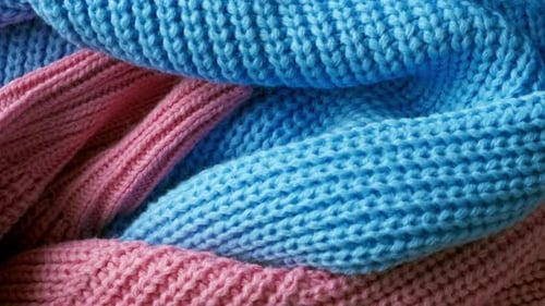 Close Up Shot of Knit Scarves in Pink, Blue, Green