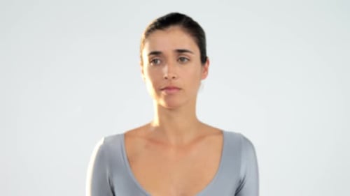 Woman gesturing on white background