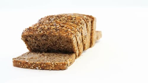 Sliced Multigrain Loaf of Fresh Bread on White