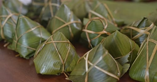 Close Up Of Leaf Wrapped Zongzi on Table