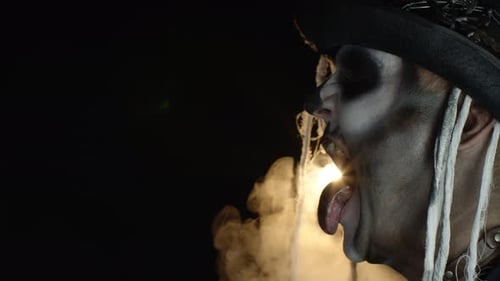 Side View of Sinister Man with Horrible Halloween Skeleton Makeup Making Faces, Opening His Mouth