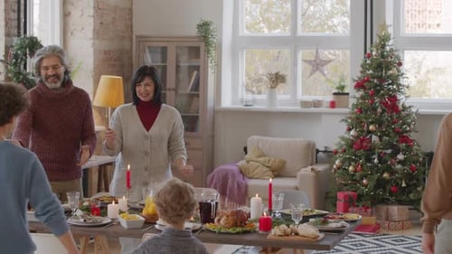 Family Gathers for Festive Christmas Dinner Celebration