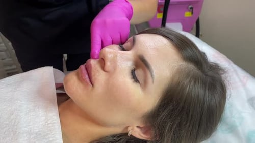Woman Receives Lip Injections in a Medical Clinic