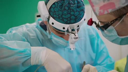 Surgery operating room. Team of professional surgeons performing operation in clinic