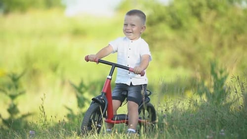 a Boy Rides a Bicycle Without Pedals