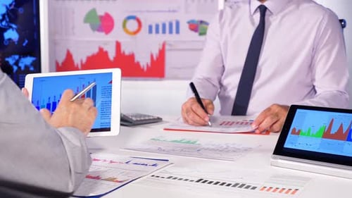 Business People Working With Charts And Financials