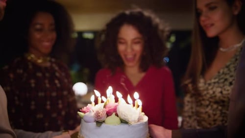 Friends Celebrating Birthday with Cake and Candles
