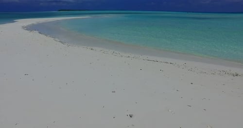 Tropical birds eye copy space shot of a white paradise beach and aqua turquoise water background in