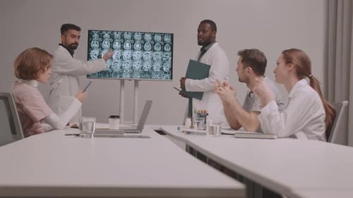 Doctors Reviewing Brain Scans in Modern Clinic
