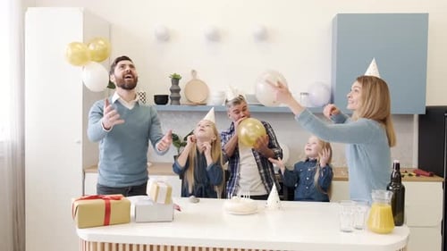 Family Fun Birthday Party with Balloons and Cake