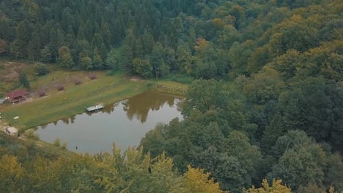 The Lake in the Middle of a Forest. View From the Top. Autumn. Aerial