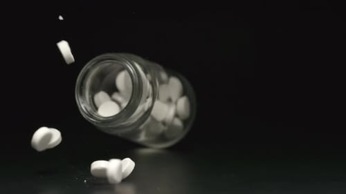 Glass jar falls and pills fall out of him
