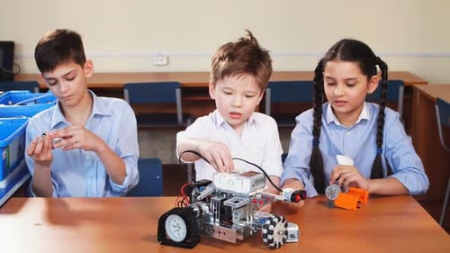 Kids Building a Robot in School Classroom