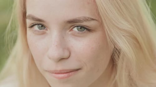 Smiling Woman with Blonde Hair Close Up Portrait