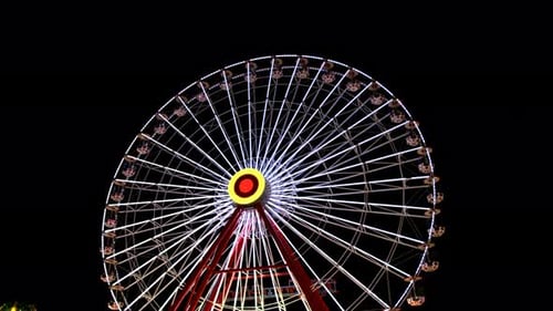 Ferris Wheel In Amusement Park At Night