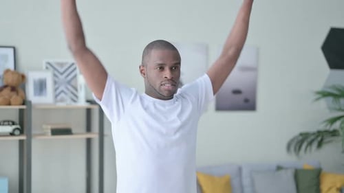 Close Up of Athletic African Man Exercising with Dumbbells