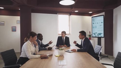 Business Team Meeting Around Conference Table