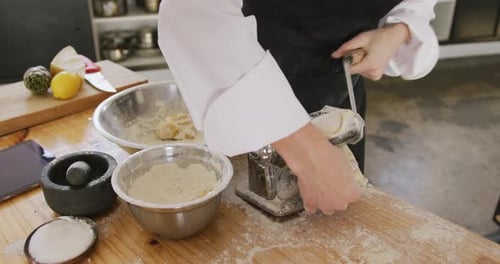 Chef Making Pasta Dough with Pasta Machine