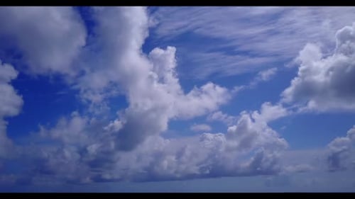 Aerial sky of beautiful resort beach voyage by blue green lagoon with white sandy background of a da