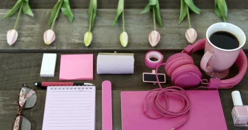 Overhead View of Pink Items with Coffee and Tulips