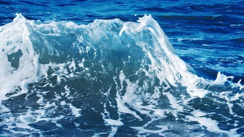 Waves Interfere Near the Shore and Create Shapes and Splashes