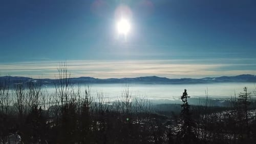 Scenic Mountain Range in Winter Landscape with Fog
