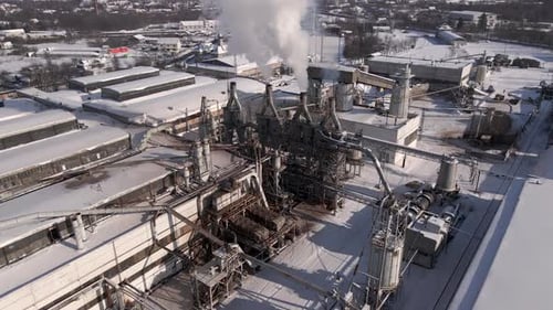 Drone Flies Over the Industrial Area Close to Factory Flying Through Smoke From the Pipes Aerial