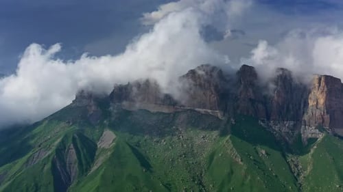 Lush Mountains with Clouds in Rugged Terrain