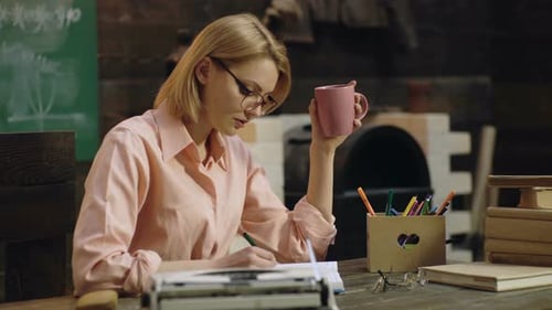 College Student Hold Cup Coffee Learning in the Classroom.