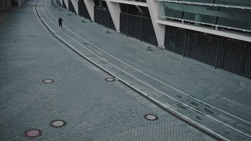 Top View at Outdoor Training Track Near Stadium and African American Man Running Fastly on It