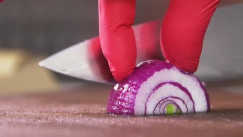 Red Onion Sliced on Cutting Board in Close Up