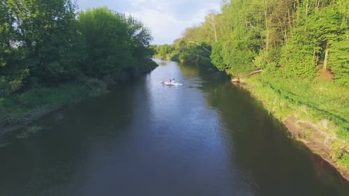 Girl in a Blue Kayak Floating