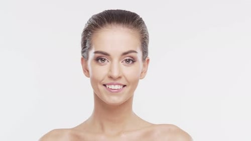 Woman Smiling Elegantly in Studio Close Up