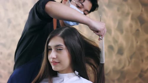 Young Woman Getting Haircut at Stylish Salon