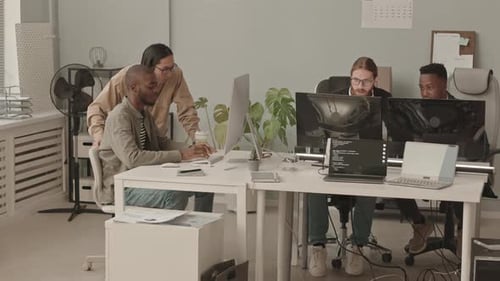 Diverse Team of Programmers Coworking in Office