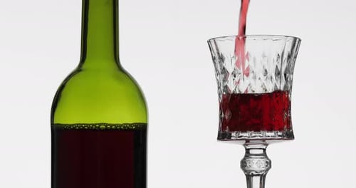 Red Wine or Beverage Poured into Glass