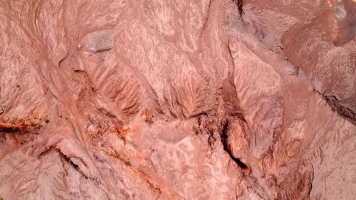 4K Aerial view of rock fissures eroded by water.