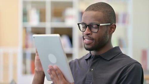 Man Using Tablet Device Indoors
