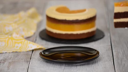 Serving Slice of Layered Cake on Plate