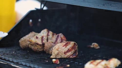 Meat On Grill. Cooking Juicy Steak On Barbecue Closeup