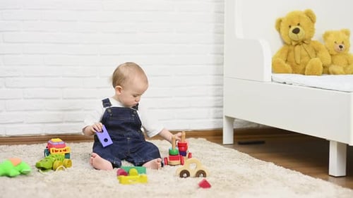 Cute Baby Playing with Colorful Wooden Toys