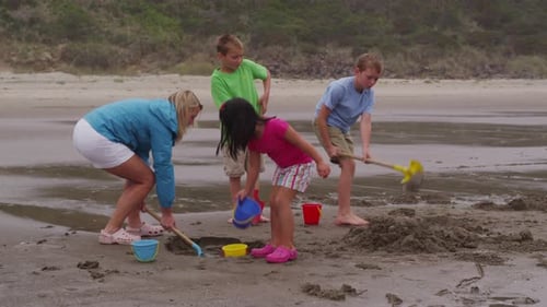 Children playing at beach. Shot on RED EPIC for high quality 4K, UHD, Ultra HD resolution.