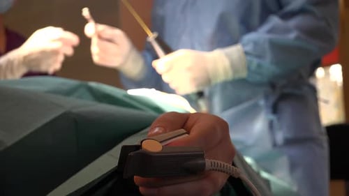 Surgeons Performing Operation in Operating Room