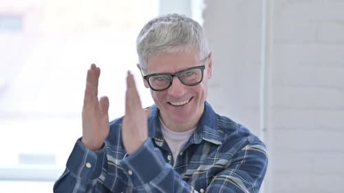 Enthusiastic Adult Clapping Happily Indoors