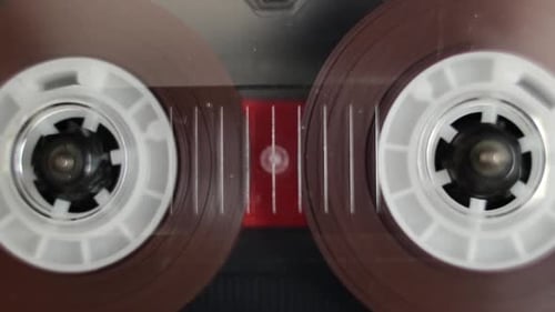Audio Cassette Tape Spinning in Player Close Up