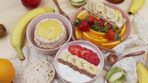 Overhead View of Bowls of Fruit and Rice Cakes